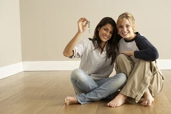 women holding keys, Cedars at Carver Park Galveston, TX